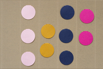 paper circle shapes on beige corrugated paper background