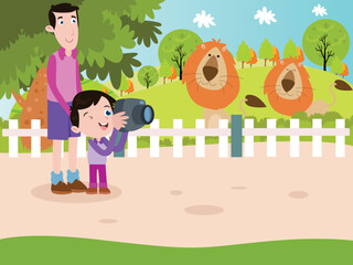 Boy and father taking picture of lions at the zoo