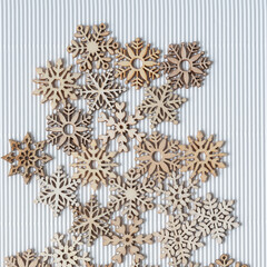 wooden snowflakes on corrugated paper