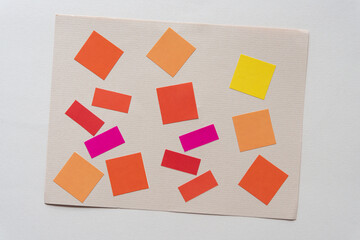 color paper stickers on beige stationery paper