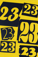 medium and large sized twenty-three on yellow corrugated paper