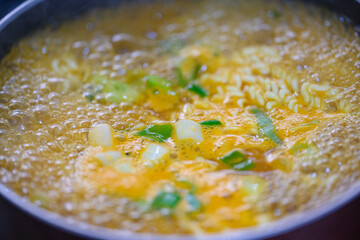 Delicious Korean instant ramen dish being cooked in a pot