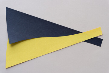 black and yellow paper shapes on beige paper