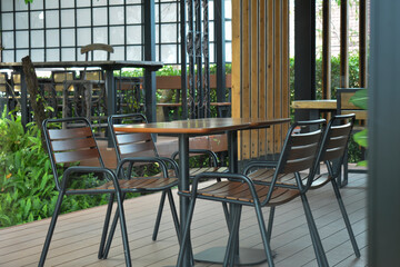 At the coffee shop, there are tables and chairs for customers.
