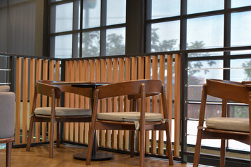 At the coffee shop, there are tables and chairs for customers.