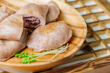susubukkumi, Korean Pan-fried Millet Rice Cake : or this dish, first make the dough by mixing glutinous sorghum powder with warm water. Next, fry flattened dough balls on a pan, add red bean filling, 