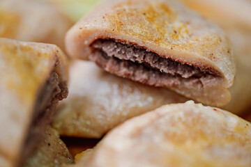 susubukkumi, Korean Pan-fried Millet Rice Cake : or this dish, first make the dough by mixing glutinous sorghum powder with warm water. Next, fry flattened dough balls on a pan, add red bean filling, 