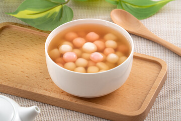 Red and white tangyuan with syrup soup.