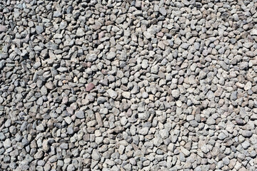 Many small and gray stones, seamless texture