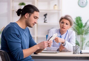 Young patient visiting doctor in hospital