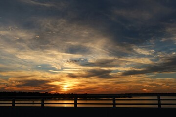 Naklejka na ściany i meble Beautiful golden sunset over the Florida river