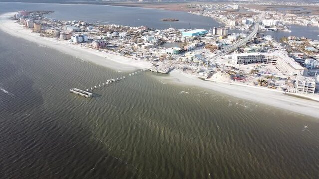 The Times Square area on Fort Myers Beach, FL is mostly reduced to rubble following historic storm surge and winds from Hurricane Ian. 