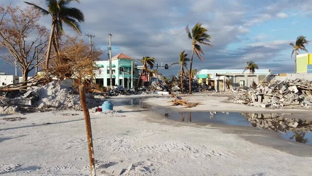 The Times Square area on Fort Myers Beach, FL is mostly reduced to rubble following historic storm surge and winds from Hurricane Ian. 