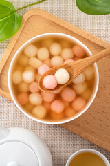 Fototapeta na wymiar Red and white tangyuan with syrup soup.
