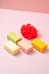 Wonderful creative composition conceptual soap shoot decorated with red body scrub loofah