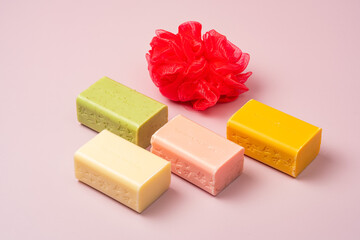 Wonderful creative composition conceptual soap shoot decorated with red body scrub loofah