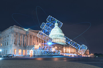Front view, Capitol dome building at night, Washington DC, USA. Illuminated Home of Congress and Capitol Hill. Glowing hologram legal icons. The concept of law, order, regulations and digital justice