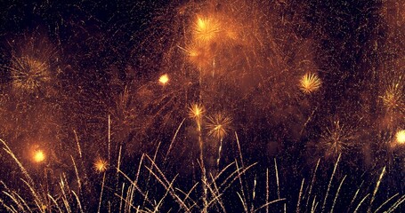 Abstract colored real firework background with big shining glowing fireworks show with bokeh lights...