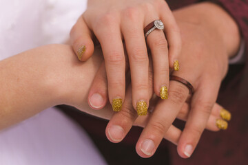 bride and groom holding hands