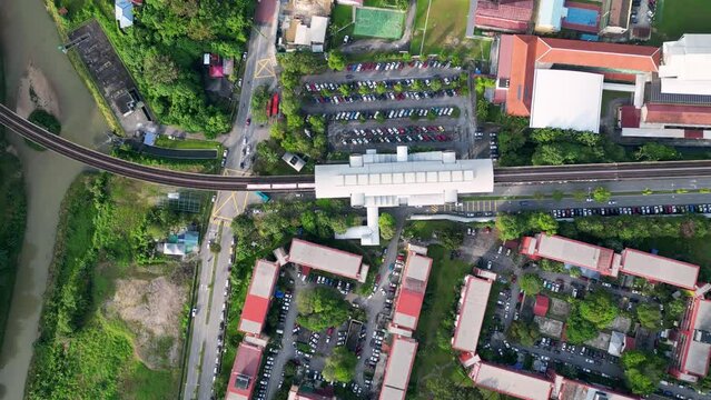 Aerial top down view LRT leave the station Sentul