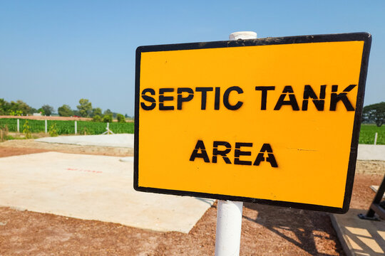 A septic tank storage area information sign at the construction site. Sign and symbol in industrial place object photo.