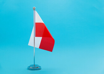Polish table flag on blue background