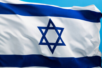 Israel national flag waving on blue background - obrazy, fototapety, plakaty