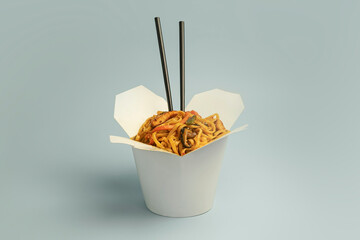 Korean noodles in white box on blue background