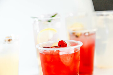 Set of different colors of lemonades and different flavors on a white background and against each other