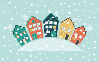 Colorful cute houses and snowfall. Winter postcard with buildings with copy space for text. Horizontal blue background. 