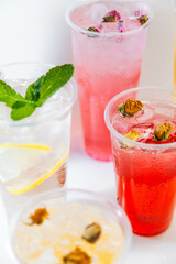 Set of different colors of lemonades and different flavors on a white background and against each other