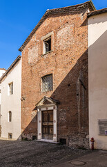 Fototapeta na wymiar Lucca, Italy. Brick facade of an old church