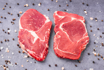 Fresh beef steak on a concrete background