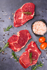 Fresh beef steak on a concrete background