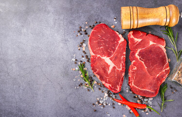 Fresh beef steak on a concrete background