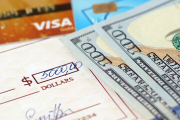 bank check, cash money, debit and credit bank card on table, various types of payments, prepare writing a check, closeup