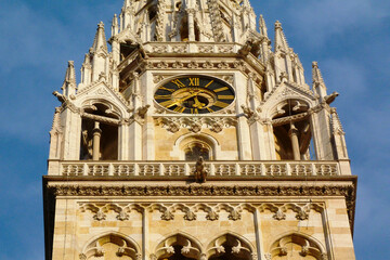 Neo Gothic style stone church clock tower. stone balustrade. detail. ornate decorative elements. Kaptol hill Zagreb. old architecture. famous Croatian landmark. travel concept. earthquake damage