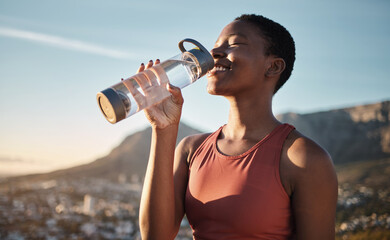 Black woman, runner and drinking water for outdoor exercise, training workout or marathon running recovery. African woman, healthy athlete and hydrate with bottle for fitness, health and cardio run - obrazy, fototapety, plakaty