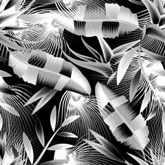 abstract wallpaper seamless pattern with tropical background. night jungle illustration with tropical banana leaves and plants foliage on dark background. prints texture. interior decorative design