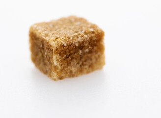 Brown sugar cube on white background