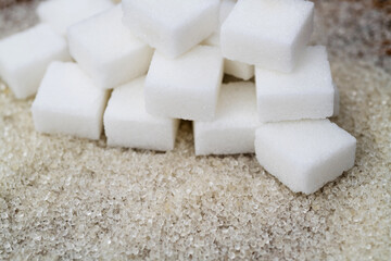 Sugar cubes on top of granulated sugar