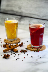 Mulled wine with cinnamon, star anise and spices in glass glasses