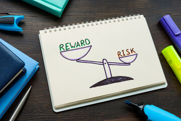 Drawn scales with inscriptions reward and risk. Negativity Bias concept.