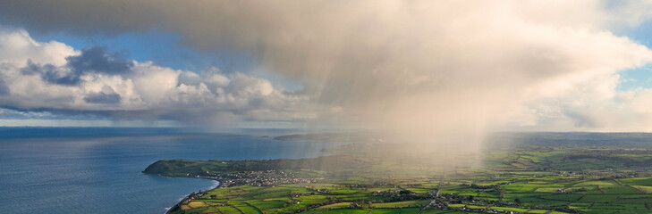 Fototapeta na wymiar Light rain mizzle clouds over Ballygally on Co Antrim Northern Ireland