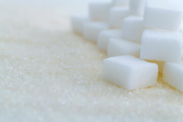Sugar cubes on top of granulated sugar
