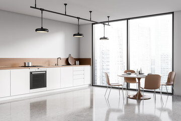 Bright modern kitchen room interior with dining table, chairs