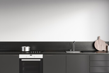 Front view on dark kitchen room interior with white wall