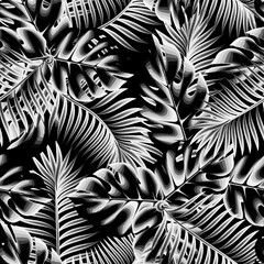 vintage monstera palm leaves seamless pattern on dark background. tropical seamless background. interior design decorative. fashionable print texture. Exotic wallpaper. coconut branches. summer. fall
