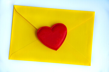 Love letter with heart shape on yellow paper envelope with customizable space for text. Love concept and copy space