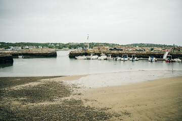 Fototapeta na wymiar Rockport, MA, USA - oct, 2022 Dinghies and working lobster boats populate Rockport, Massachusetts Harbor
